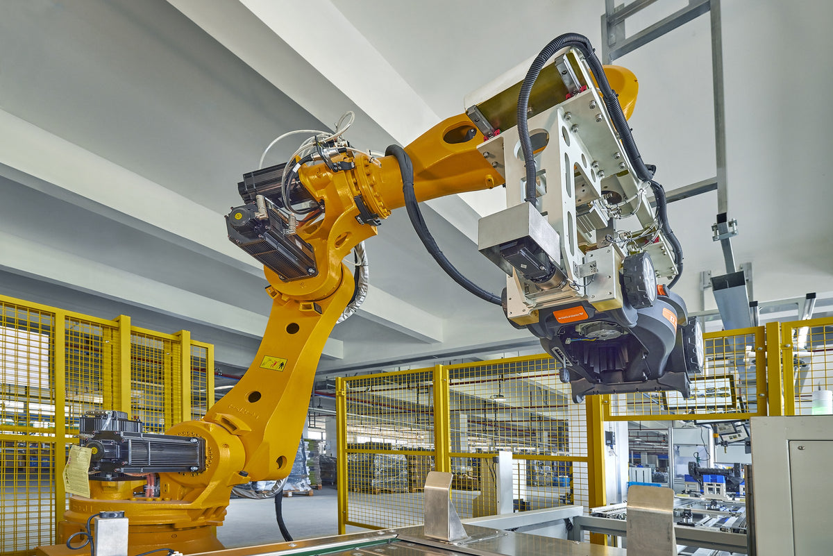 Robotic handling of a Yard Force mower on the garden equipment production line